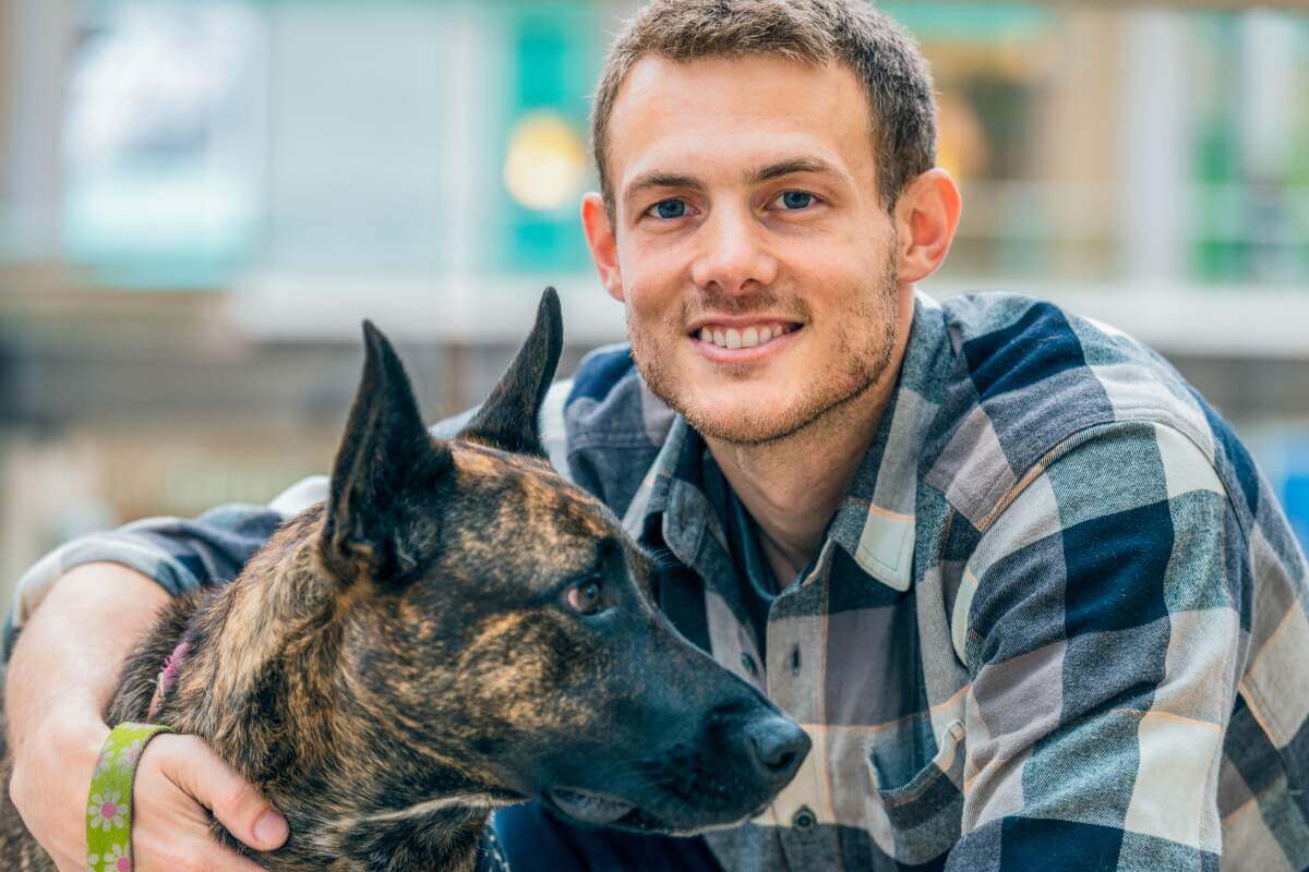 Young guy with brindle Shepherd mix